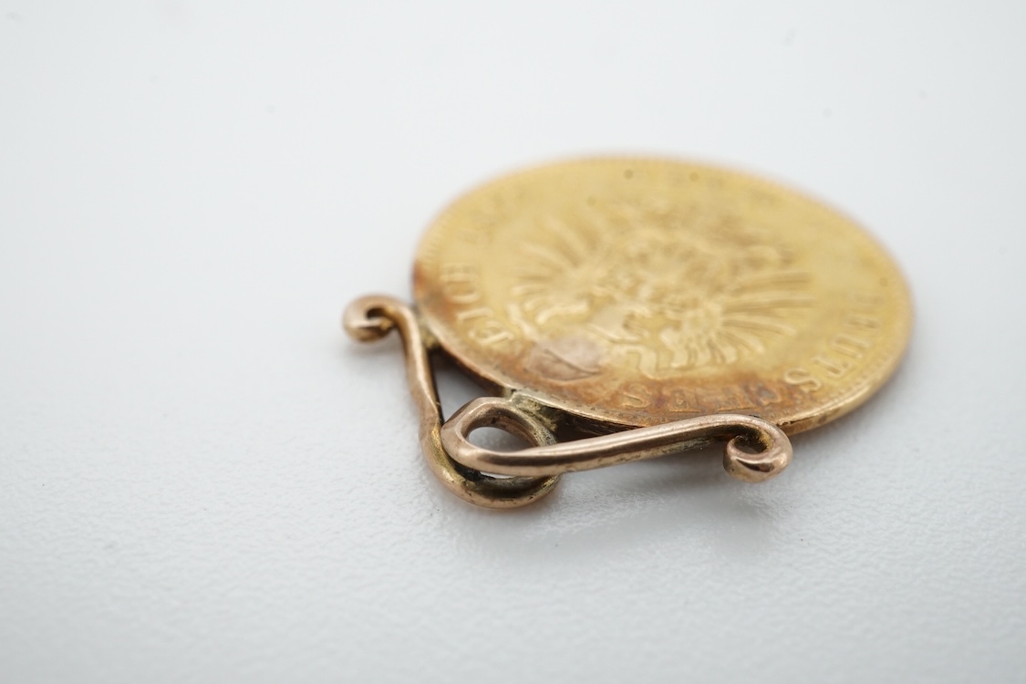 A German 1877 5 mark gold coin, now mounted on a yellow metal pendant mount, gross weight 2.2 grams.